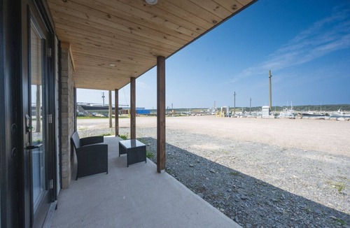 Cheticamp House | Charming Dockside Escape: Life by the Ocean