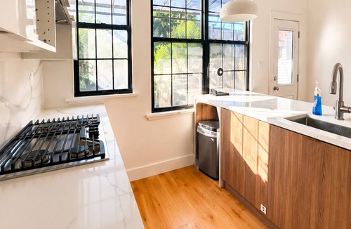 Cypress Hills House | Spacious Brooklyn Townhouse Theater Backyard Sleeps 16+