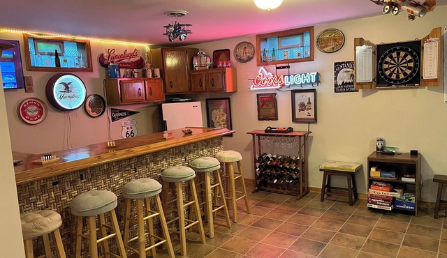 This spacious, pristine 5 bedroom retreat is ideal for families & larger groups in Akron